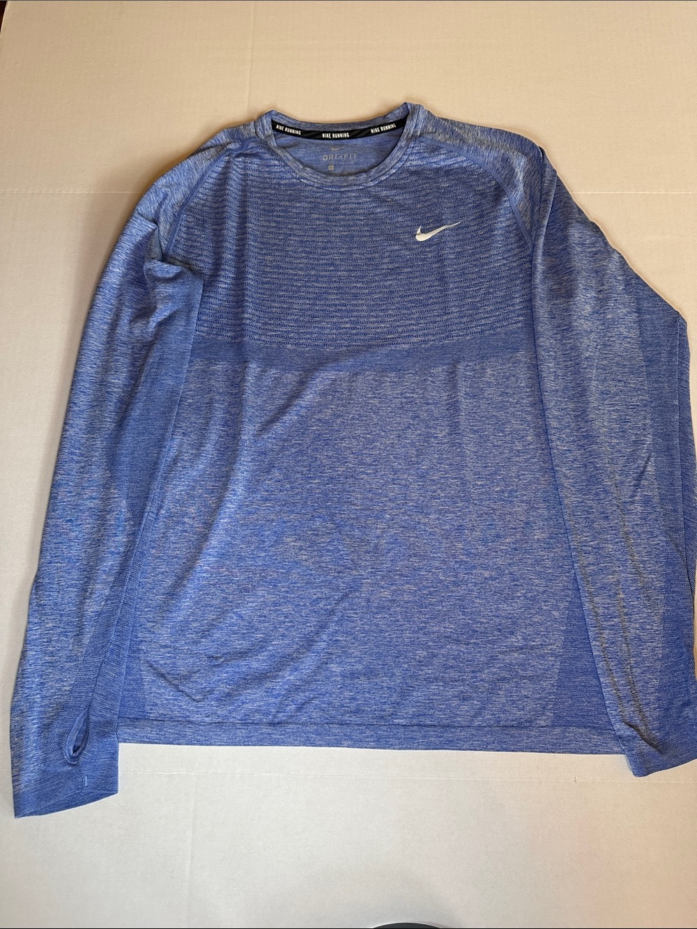 Nike Men's Long Sleeve Heather Blue Dri-FIT Top with Grey Swoosh
